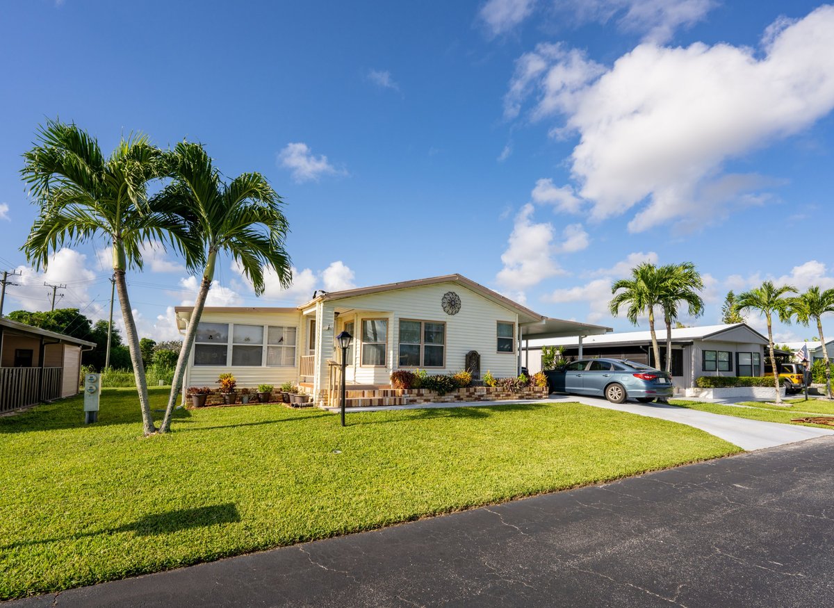 1980s style manufactured home in a mobile home community, Florida retirement neighborhood